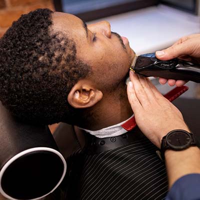 hairdresser-grooming-their-client_23-2149205916